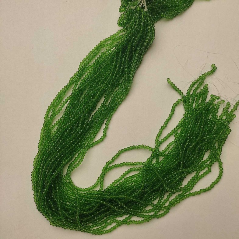 חרוזים מקריסטל צ'כי ירוקים, שקופים, רונדל גרנובני, קוטר 3×2.5 מ״מ, אורך 37 ס״מ על חוט