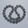 חרוזי המטיט בצבע שחור מט, קוטר 12×4,5 מ״מ ±, אורך 41 ס״מ ± על החוט