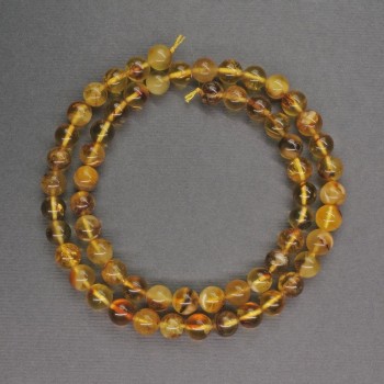 חרוזי ענבר בצורת כדור חלק, קוטר 6 מ״מ ±, אורך 40 ס״מ ±