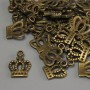 אביזרי תכשיטים תליה «כתר» בצבע ברונזה, מידות 15×10×1 מ״מ ± פתח, קוטר 2 מ״מ ± אריזה 20 גרם (~36 יח)