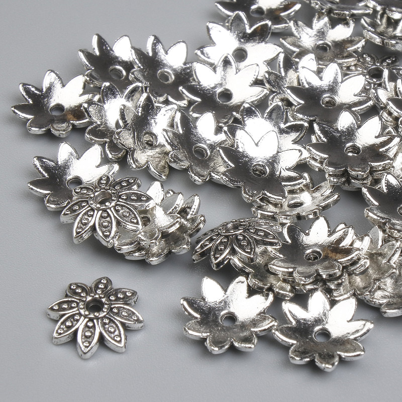 כובע חרוז מתכת בצבע כסף, קוטר 9.5×1 מ״מ ± חור 1.7 מ״מ ± אריזה 40 יחידות +