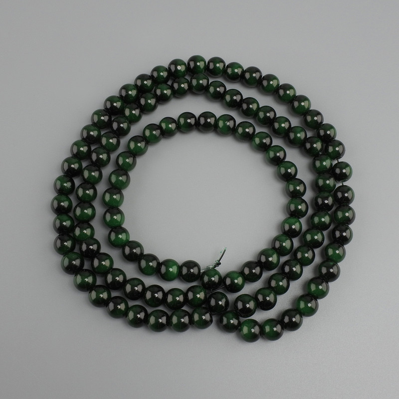 חרוזים עין הנמר ירוק (מלאכותי) כדור חלק, קוטר 8mm+-, אורך 80cm+- על חוט ניילון