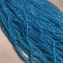 חרוזים מקריסטל צ'כיה על חוט דק בצבע כחול-ירקרק שקוף, רונדל מלוטש, קוטר 3,5×3 מ"מ +/- אורך 36-38 ס"מ +
