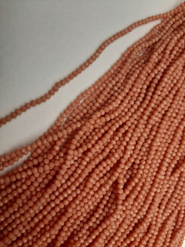 חרוזים מקריסטל צ'כי בצבע אפרסק, רונדל מחורץ, קוטר 3,5×3 מ״מ, אורך 38 מ״מ על חוט