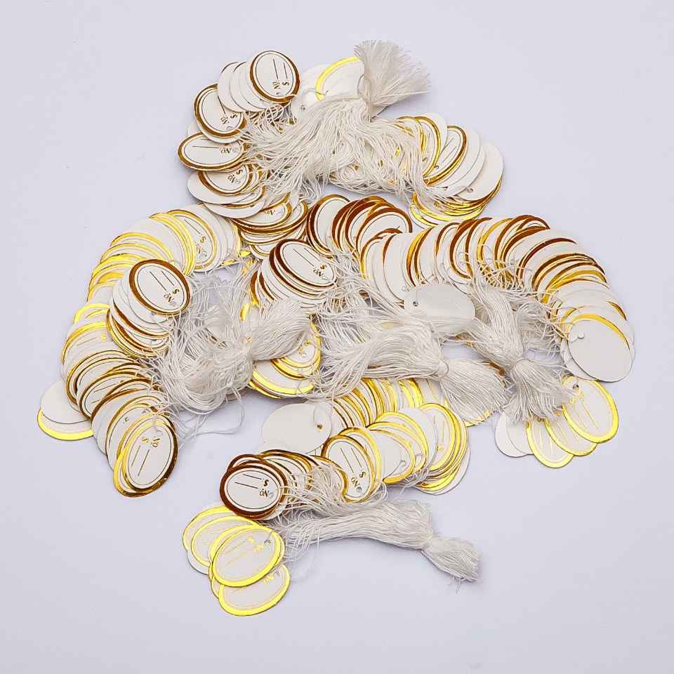 תג מחיר על חוט 26×17 מ"מ ± 100 יח'