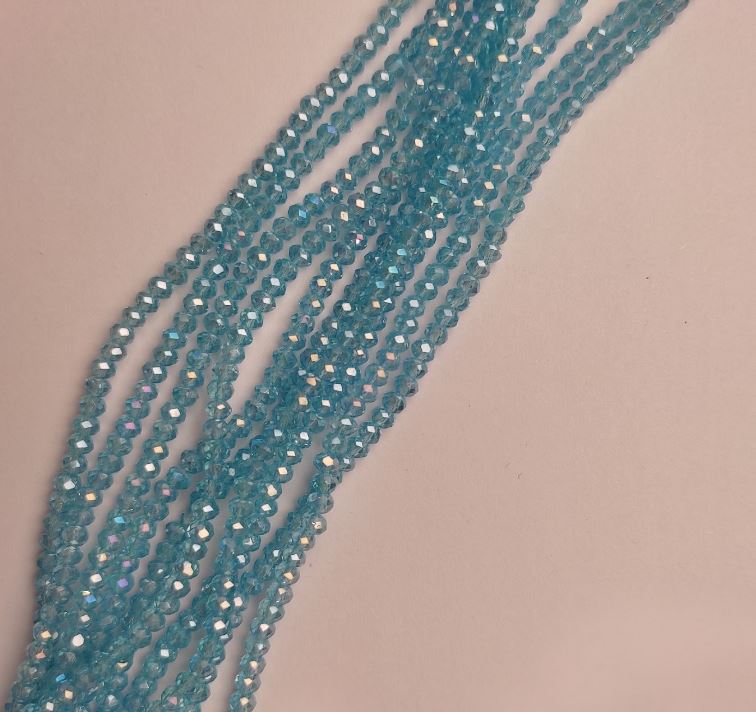 חרוזי קריסטל צ'כי על חוט כחול בהיר עם ברק שמני, רונדל מלוטש, קוטר 3,5×2,5 מ״מ, אורך 38 ס״מ +