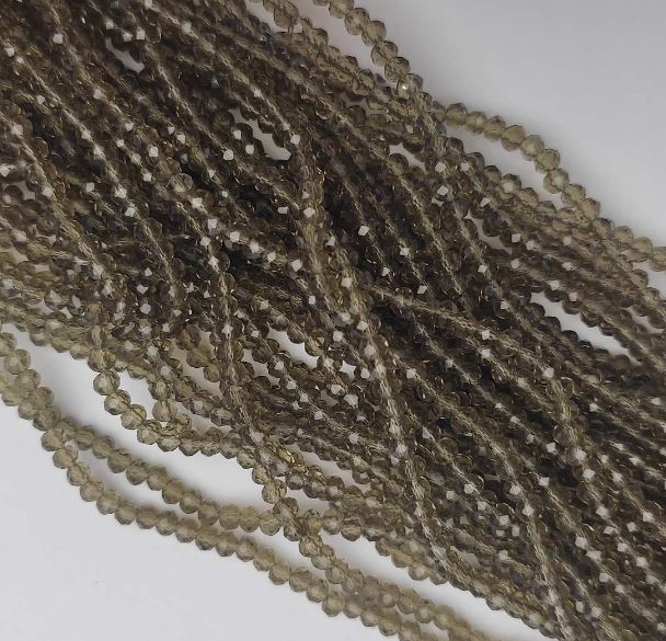 חרוזים מקריסטל צ'כי שקופים בגוון שמפניה «רונדל», קוטר 3,5×2,5 מ״מ, אורך 38 ס״מ על החוט