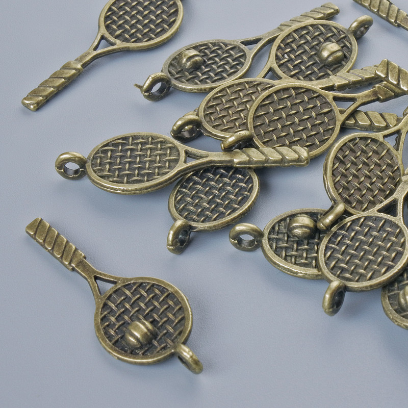 פרזול לתלייה «מחבט», קוטר 29×10 מ״מ, קוטר החור 1.8 מ״מ, אריזה: 17 יחידות ±, צבע מתכת ברונזה