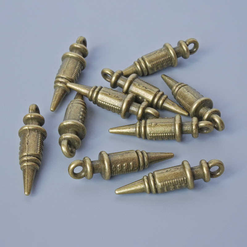 אביזרי תלייה «מזרק», קוטר 24,5×6,5 מ״מ, קוטר החור 2 מ״מ, אריזה 10 יח' ±, צבע מתכת ברונזה