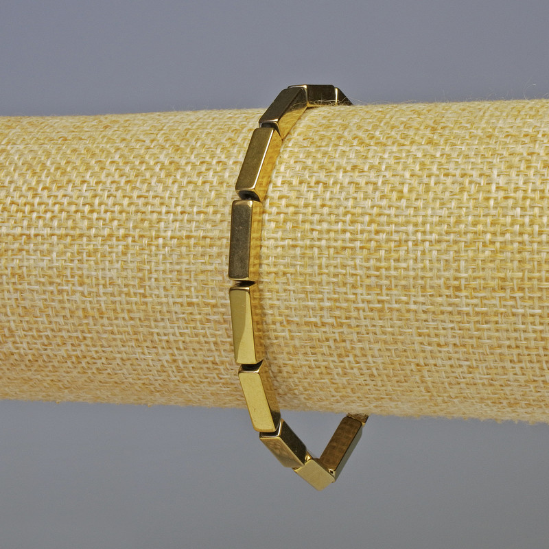 צמיד המטייט בצורת מלבן בצבע זהב, קוטר 12×4 מ״מ +-+-, אורך 18 ס״מ+- אלסטי