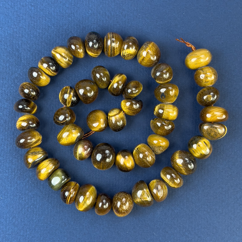 חרוזי עין האריה מלוטשים 11×10 מ״מ+- על החוט, אורך 40 ס״מ+