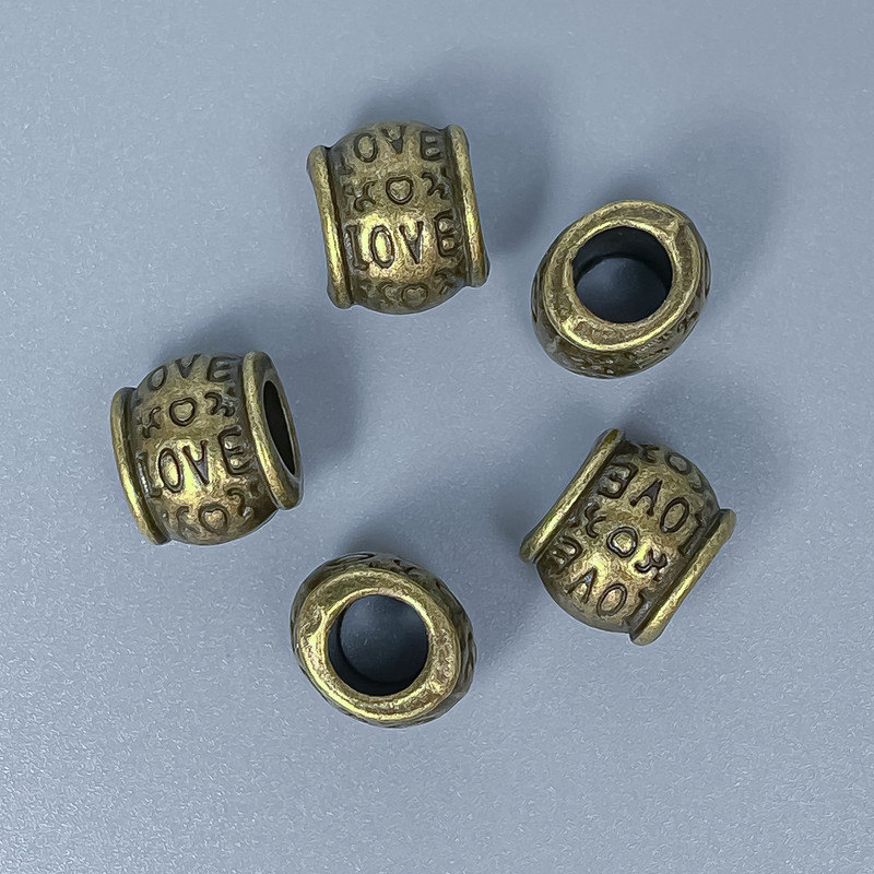 אביזרי חרוזים — חרוז-הכנסה בצבע ברונזה, קוטר 9×10 מ״מ ± פתח, קוטר 5 מ״מ ± אריזה 10 יחידות