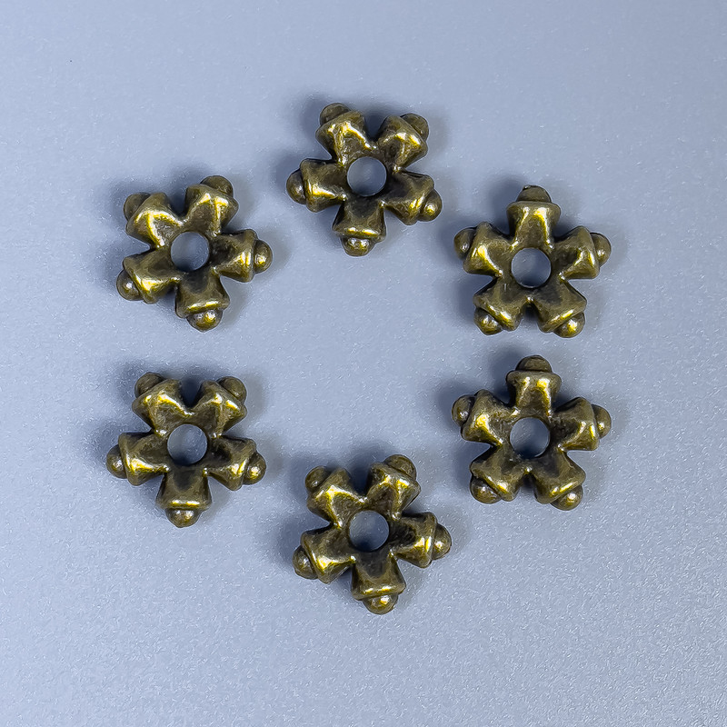 חרוז-הכנסה ברונזה, קוטר 11×4 מ״מ, חור 3 מ״מ, אריזה 20 יחידות