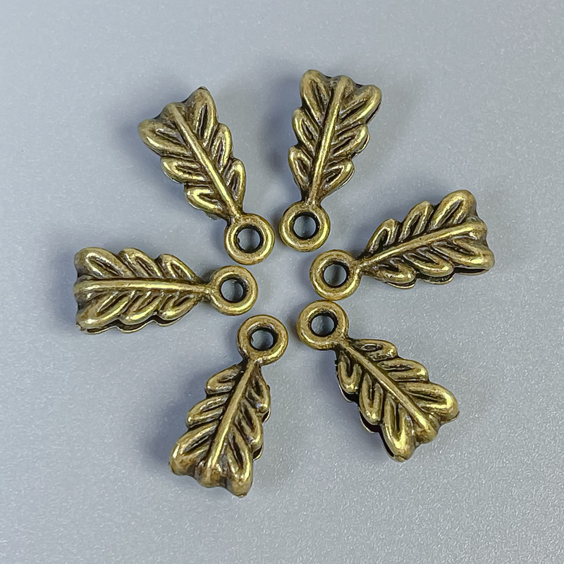 אביזרי בייל בצבע ברונזה, גודל 14×7×5 מ״מ ± פתחים כ-2.5 מ״מ וכ-1.8 מ״מ ±, אריזה 22 יחידות