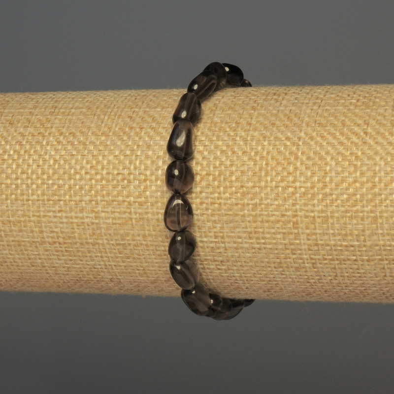 צמיד טופז מעושן – חרוזי חתוכים, קוטר 7–10×7 מ״מ, אורך 18 ס״מ, סטרץ'
