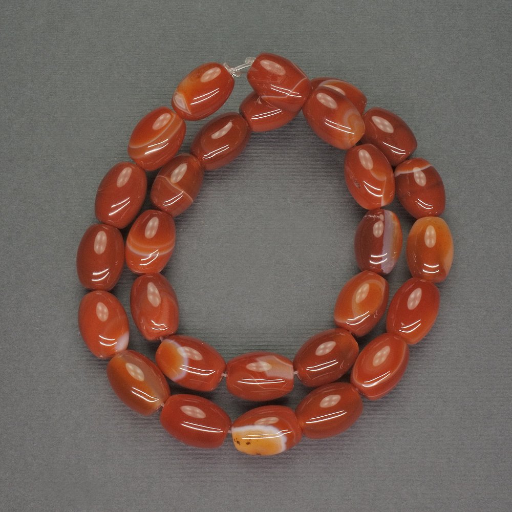 חרוזי סרדוניקס טבעיים בצורת באריל, קוטר 10×13 מ״מ, אורך 38 ס״מ