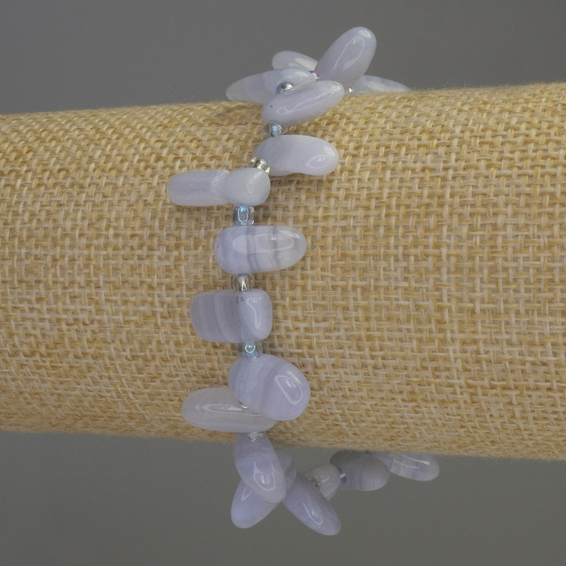 צמיד אגת כחולה מחוספסת, קוטר 7×14 מ״מ ±, אורך 18 ס״מ אלסטי