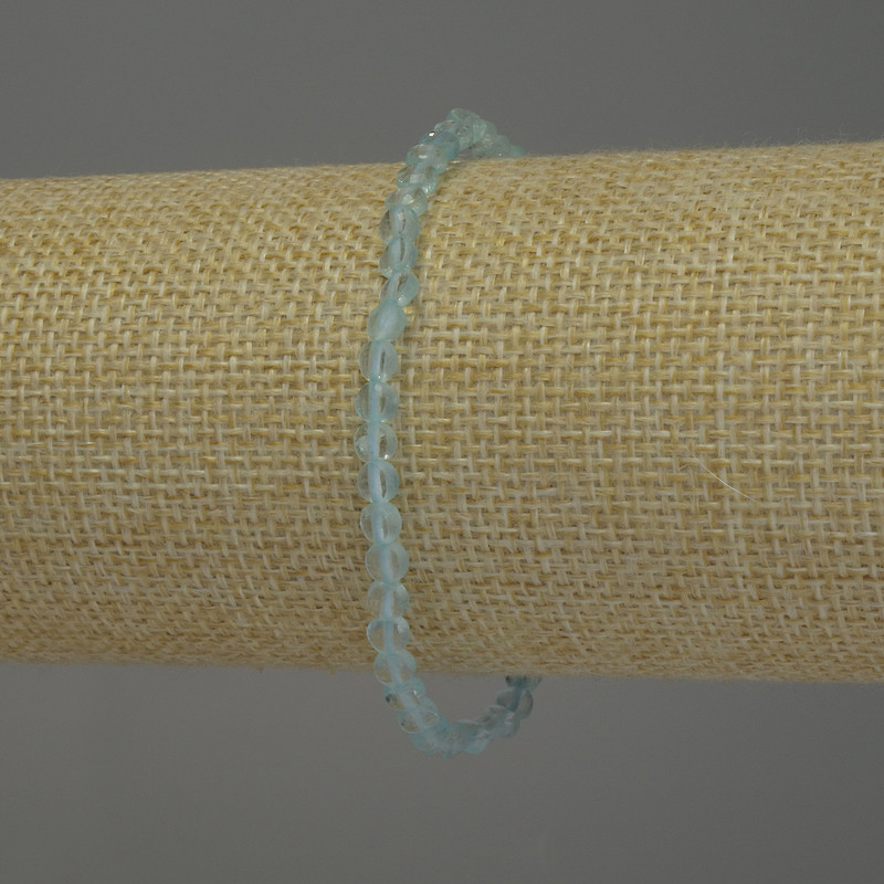 צמיד טופז טבעי, מטבע מלוטש בקוטר 4 מ״מ, אורך 18 ס״מ, בסיס אלסטי