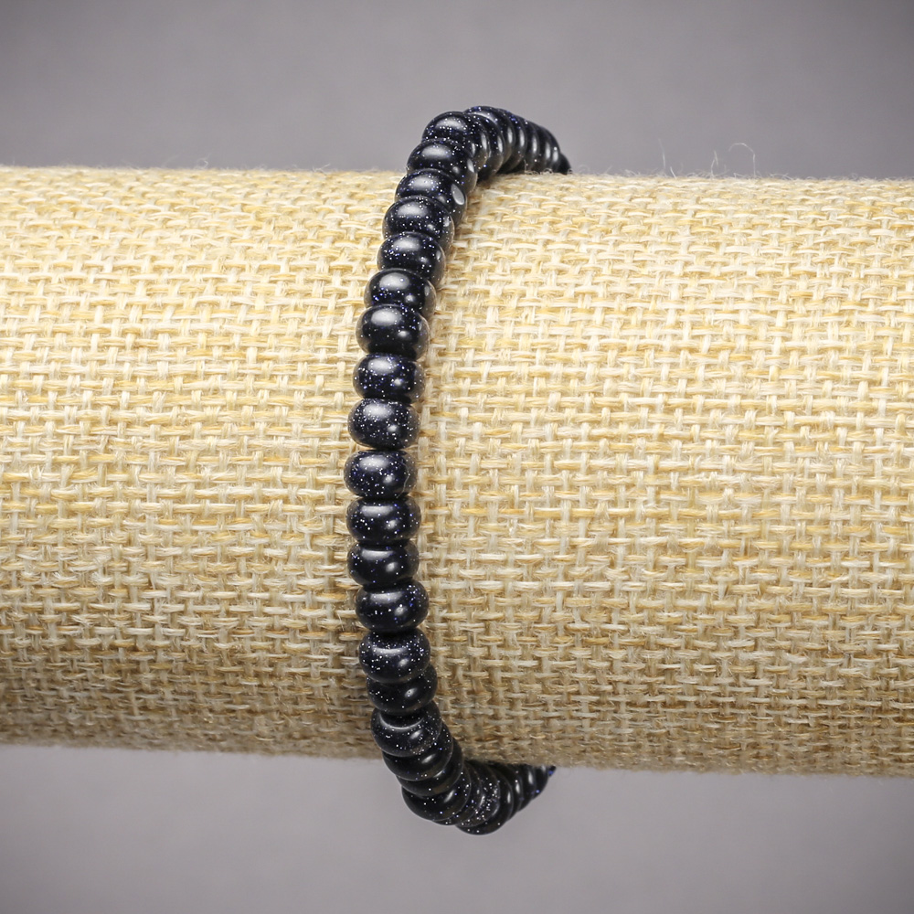 צמיד גומי מאבנטורין חול כחול לילה של קהיר (מדוחס) רונדלים חלקים, קוטר 6×4 מ״מ+-, אורך 18 ס״מ+