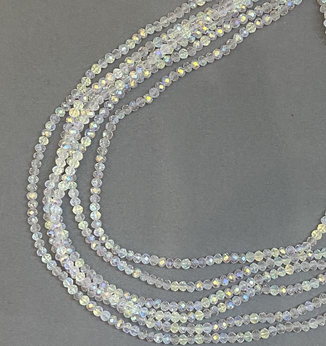 חרוזי קריסטל צ'כי לבנים שקופים על חוט דייג, עם ברק בנזיני, בצורת רונדלים מחוספים, קוטר 3,5×3 מ״מ, אורך 33 ס״מ +