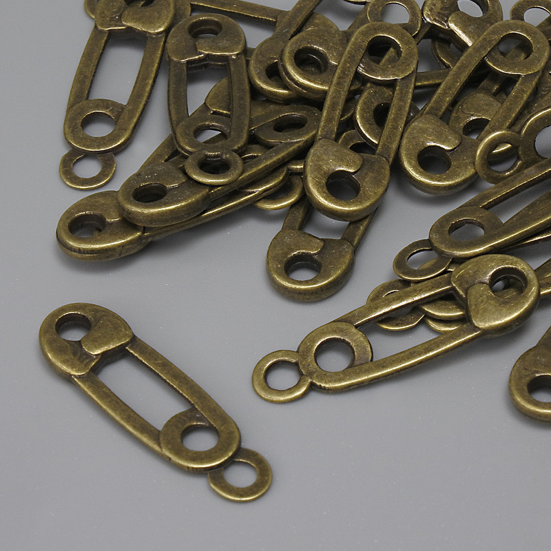 תליון-תלייה «שפיץ» בצבע ברונזה עתיקה, קוטר 23×7 מ״מ, פתח אוזן 2.2 מ״מ, אריזה 22 יחידות