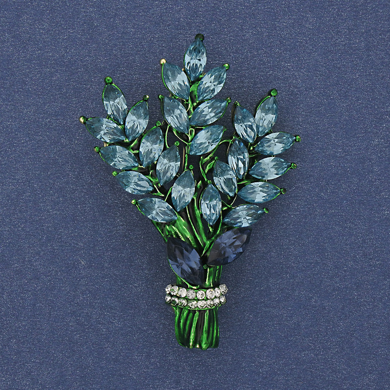 סיכה «ענף» עם קריסטלים תכלת ולבן ומתכת זהובה 43×29 מ״מ +