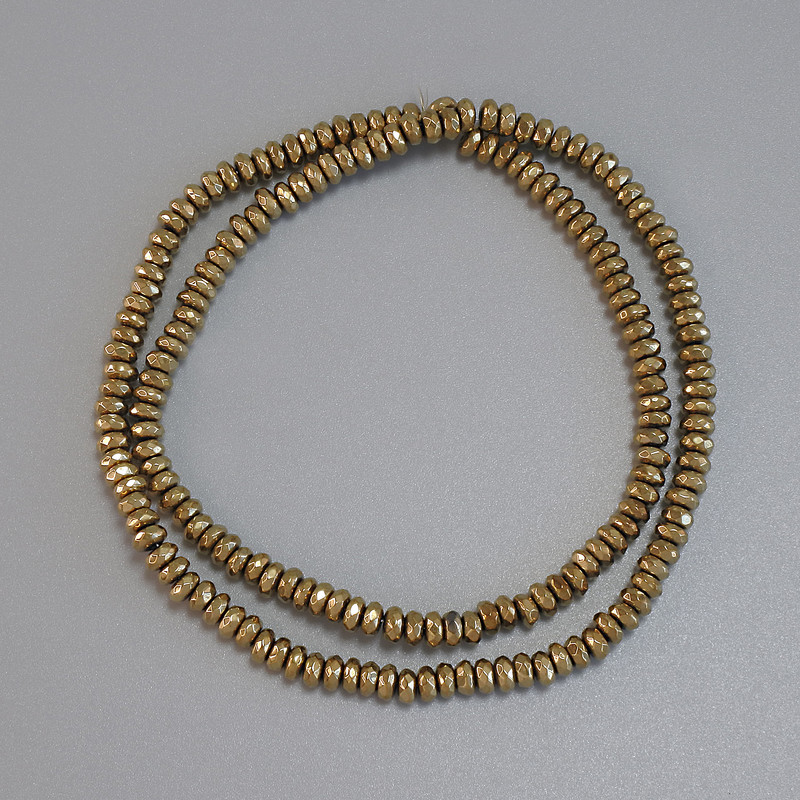 חרוזי המטיט בצבע זהב, צורה רונדל מחוספסת 4×2 מ״מ ± על חוט, אורך 38 ס״מ+