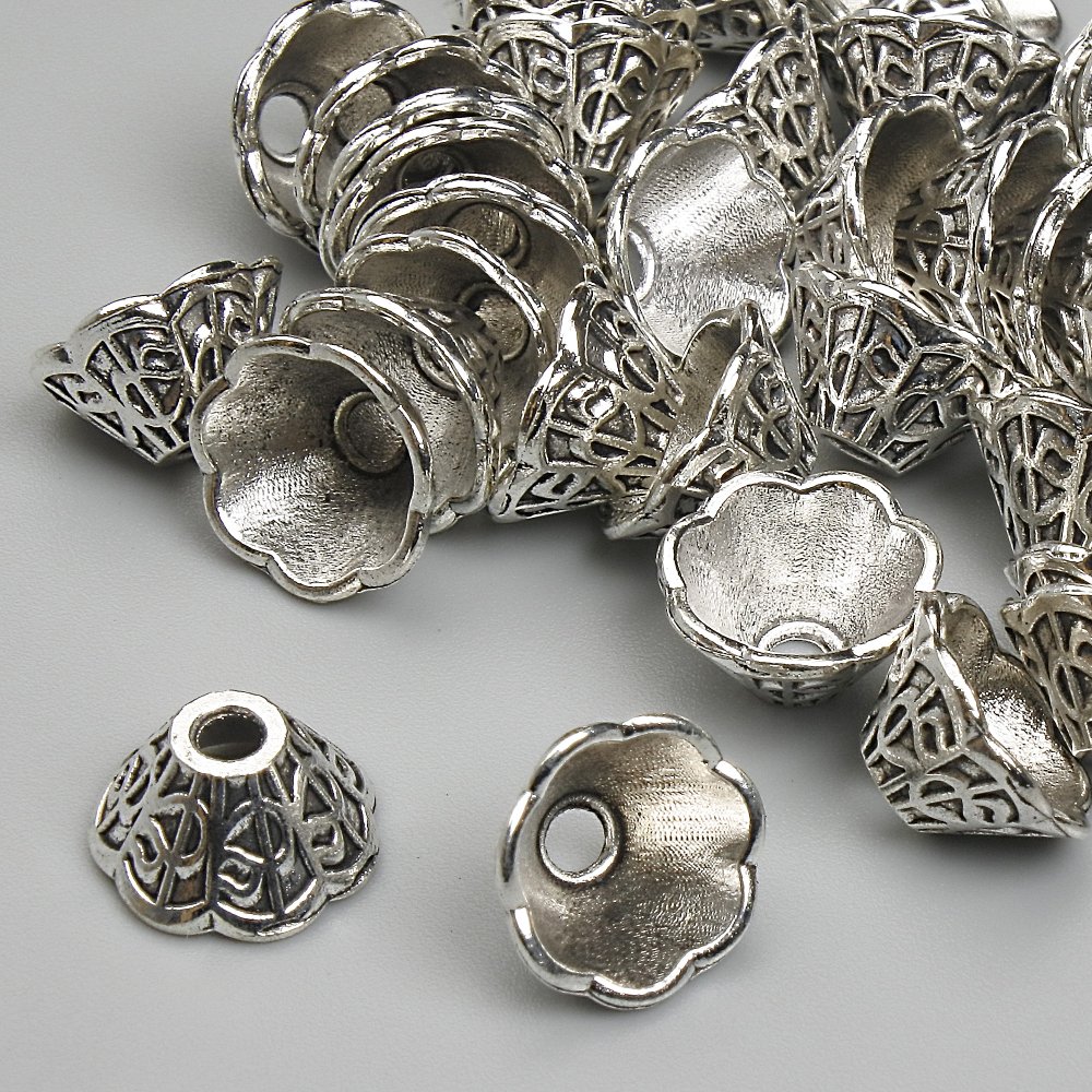 קצה פרזול כסוף, קוטר 6×9 מ״מ, פתח 2.2 מ״מ, צבע מתכת כסוף, אריזה 20 גרם (~40 יח')