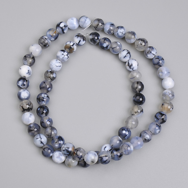 חרוזי אגת עורק הדרקון חלקים בקוטר 6 מ״מ, אורך כ-37 ס״מ ± על חוט