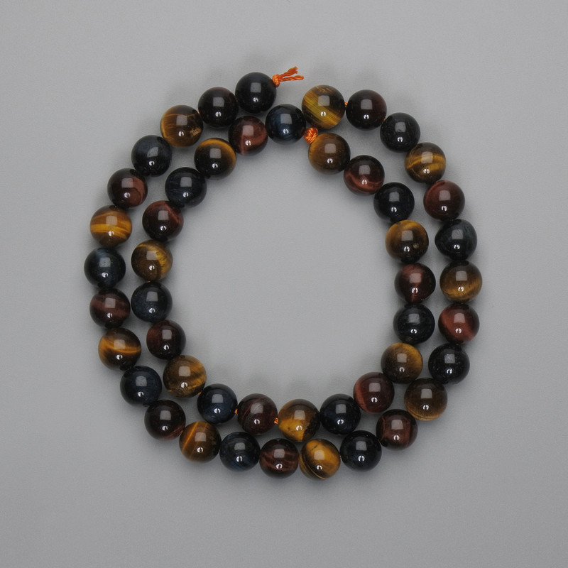 חרוזי עין השור, עין הטייגר ועין הנשר – כדור חלק בקוטר 8 מ״מ, אורך החוט כ-37 ס״מ