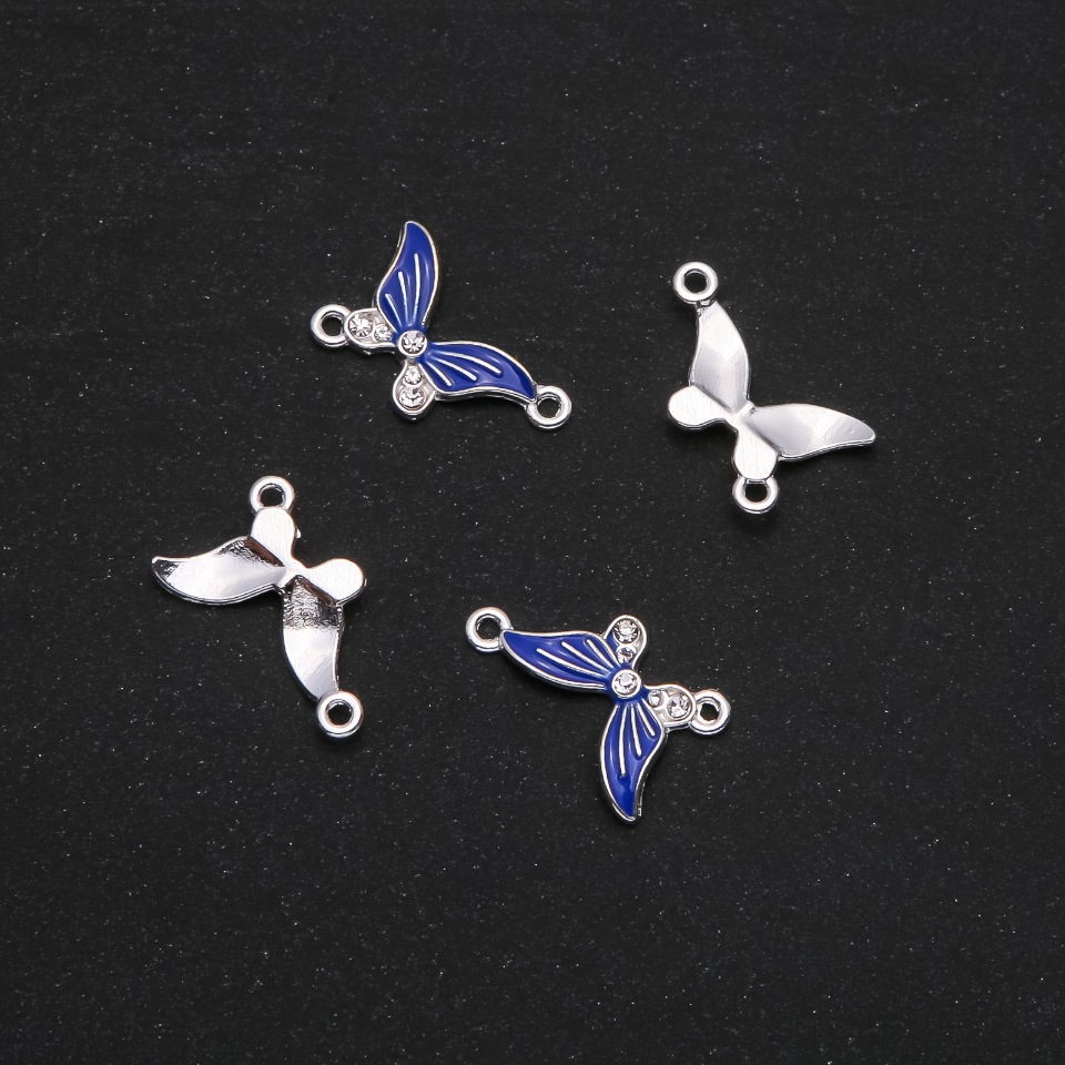 אביזרי תכשיטים — מחבר 'פרפר' אמייל כחול 24×12 מ״מ, מאריזה 4 יחידות