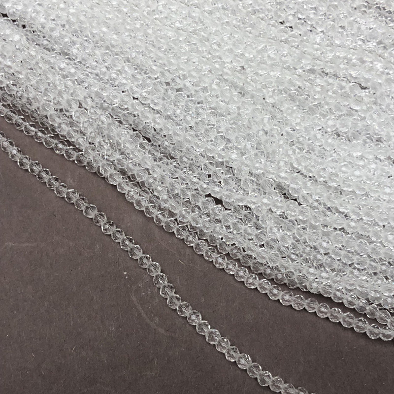 חרוזים מקריסטל צ'כיה על חוט דק לבן שקוף, מרונדל מחוספס בפאות, קוטר 3×2.5 מ״מ + -, אורך 36 ס״מ +