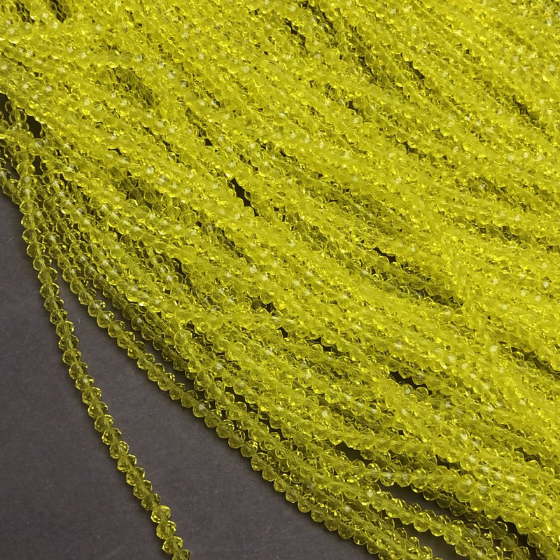 חרוזי קריסטל צ'כיה מגולפים על חוט צהובים שקופים בקוטר 3×2.5 מ״מ + -, אורך 36–38 ס״מ +