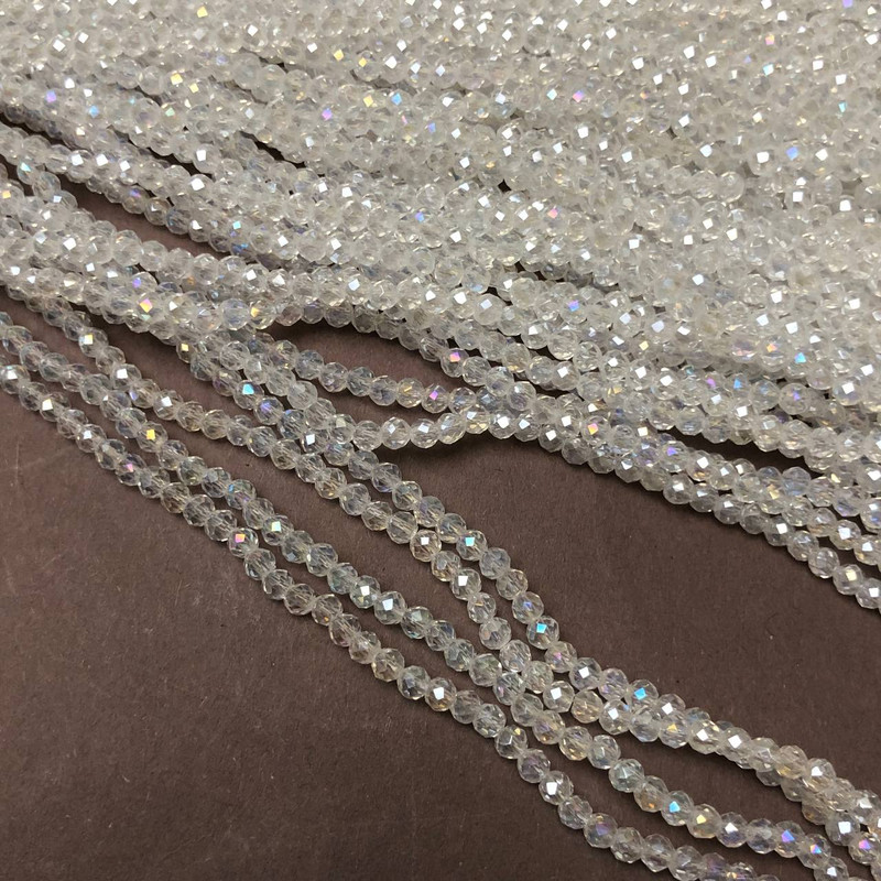 חרוזי קריסטל צ'כיה על חוט לבן שקוף עם זוהר בנזיני, צורה מחוספסת של רונדל, קוטר 3×2.5 מ״מ + -, אורך 36–38 ס״מ +