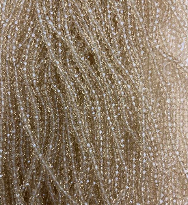 חרוזים מקריסטל צ'כי על חוט חרוזים בצבע שמפניה שקוף, צורה רונדל מחוספנת, קוטר 3,5×3 מ״מ, אורך 32 ס״מ