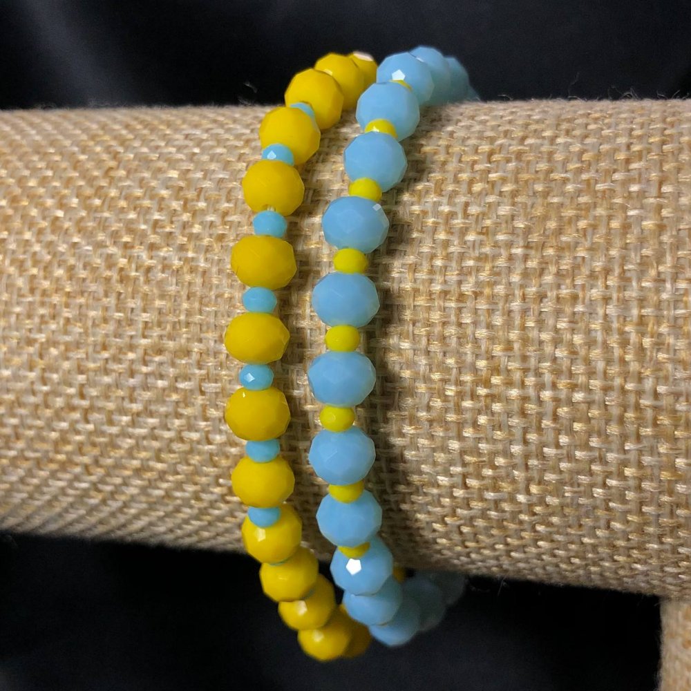 צמיד זוגי על גומי מקריסטל צ'כי – רונדלים מחורצים בקוטר 6×4 מ״מ, אורך 18 ס״מ+-