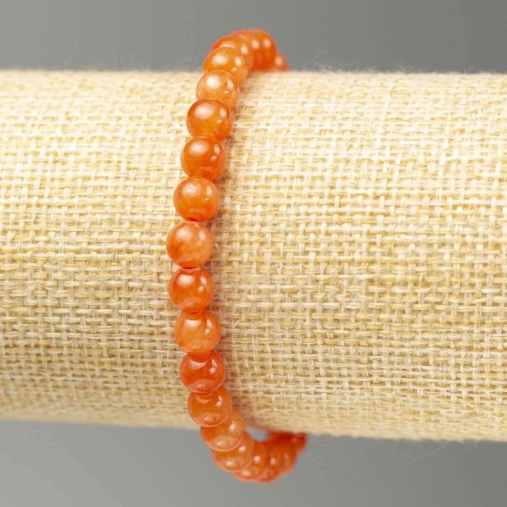 צמיד גומי אלסטי בציטרין (אקריל סינתטי) חרוז חלק קוטר 6 מ״מ +-, אורך 18 ס״מ+