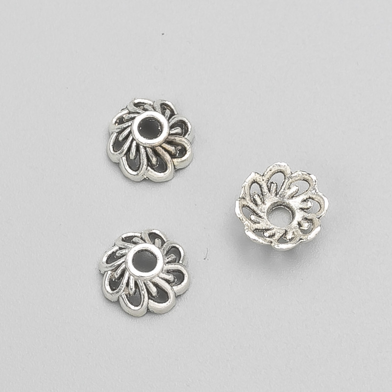 קצה פרזול בצבע כסף, קוטר 9×4 מ״מ, אריזה -20 גרם. 64 יחידות (±)