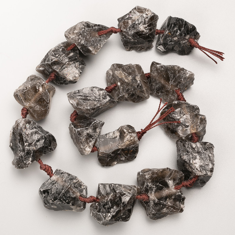 חרוזי טופז מעושן, אבן טבעית גולמית, חיתוך על חוט, בקוטר 25×27 מ״מ ±, אורך 42 ס״מ ±